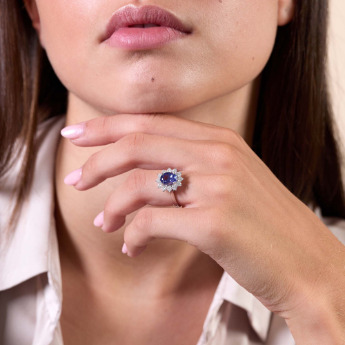 18ct White Gold Oval Cut Tanzanite and Brilliant Cut Diamond Cluster Ring