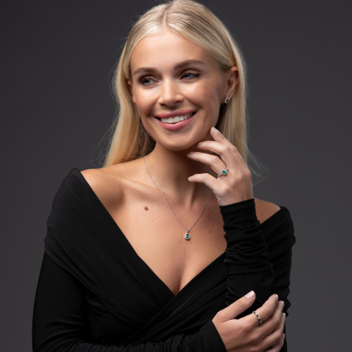 18ct White Gold Diamond And Emerald Pear Halo Earrings with matching necklace and ring.