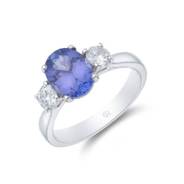 18ct White Gold Oval Cut Tanzanite and Brilliant Cut Diamond 3.12ct Three Stone Ring
