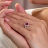 18ct White Gold Oval Cut 1.40ct Ruby Solitaire Ring with Diamond Set Halo and Shoulders
