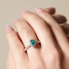 18ct White Gold Oval Cut 0.35ct Emerald and 0.49ct Diamond Halo Ring