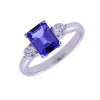 18ct White Gold Emerald Cut Tanzanite and Brilliant Cut Diamond 0.34ct Three Stone Ring