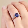 18ct White Gold Emerald Cut Tanzanite and Brilliant Cut Diamond 0.34ct Three Stone Ring