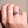 18ct White Gold 0.88ct Oval Cut Pink Sapphire and 0.30ct Diamond Cluster Ring