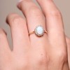 9ct Yellow Gold 0.78ct Oval Opal & Round Brilliant Diamond Halo Ring