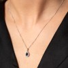 9ct White Gold Round Brilliant 0.19ct Diamond and Pear Cut Sapphire Halo Pendant