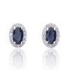 9ct White Gold Oval Cut 0.70ct Sapphire and 0.10ct Diamond Halo Stud Earrings