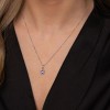 9ct White Gold 0.06ct Diamond and Tanzanite Halo Pendant