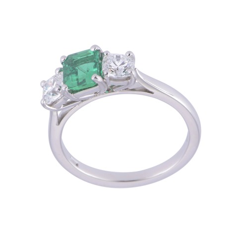 Platinum octagonal 0.65ct emerald and cushion 0.64ct diamond 3 stone. Colour D Clarity VVS1.