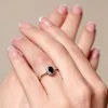 9ct White Gold 0.50ct Oval Sapphire and 0.05ct Diamond Cluster Ring