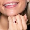 18ct White Gold Emerald Cut 1.07ct Ruby and 0.39ct Diamond Three Stone Ring