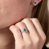 18ct White Gold 0.40ct Diamond And 0.38ct Emerald Pear Halo Solitaire