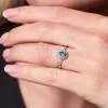 9ct White Gold 0.40ct Pear Emerald and 0.38ct Diamond Cluster