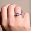 18ct White Gold 0.88ct Oval Cut Pink Sapphire and 0.30ct Diamond Cluster Ring