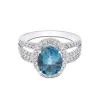 18ct White Gold Brilliant Cut Diamond And Oval London Blue Topaz 0.34ct And 2.00ct Halo Ring
