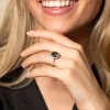 18ct White Gold Diamond 0.22ct and London Blue 5.21ct Halo Ring