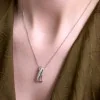 18ct White Gold Baguette & Round Brilliant Cut 0.60ct Diamond Multi Strand Cross Over Pendant
