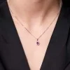 18ct White Gold 0.38ct Diamond And 0.17ct Ruby Oval Halo Pendant