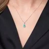 9ct White Gold 0.50ct Pear Cut Emerald and 0.19ct Diamond Halo Pendant
