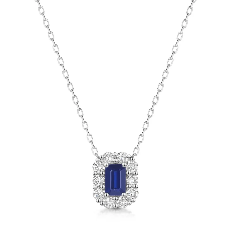 18ct White Gold 0.70ct Emerald Cut Sapphire and 0.55ct Diamond Halo Pendant