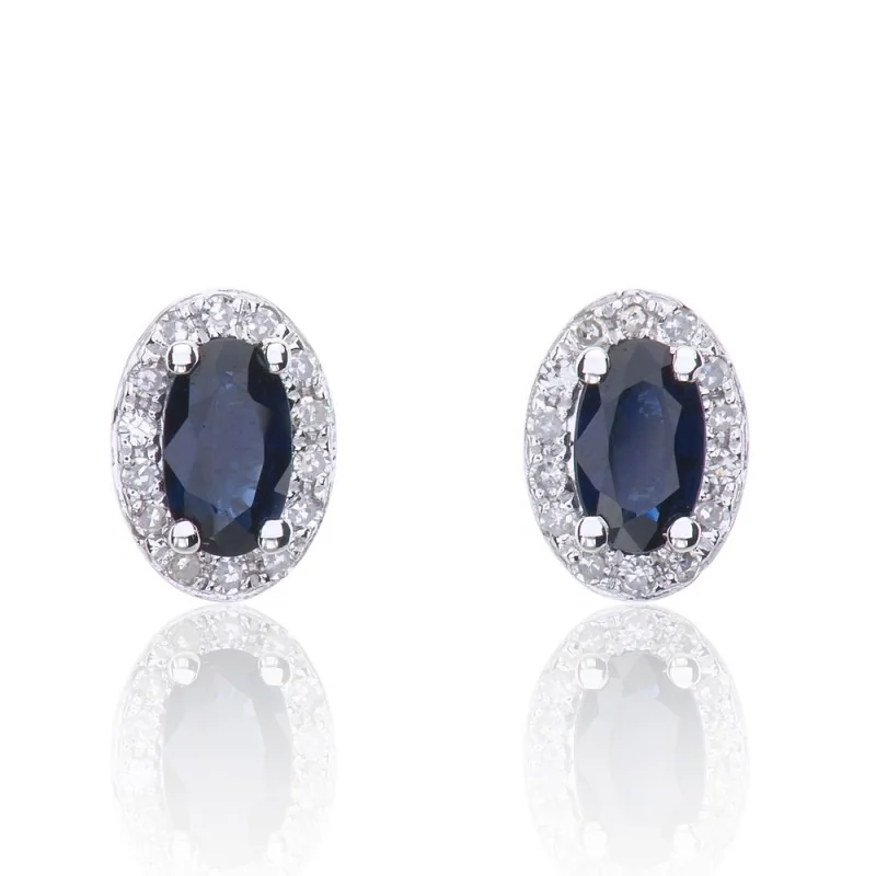 9ct White Gold Oval Cut 0.70ct Sapphire and 0.10ct Diamond Halo Stud Earrings
