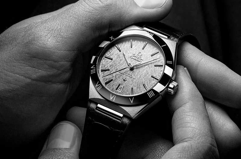 Watch Servicing & Repairs - Image of a hand holding an OMEGA Constellation Watch