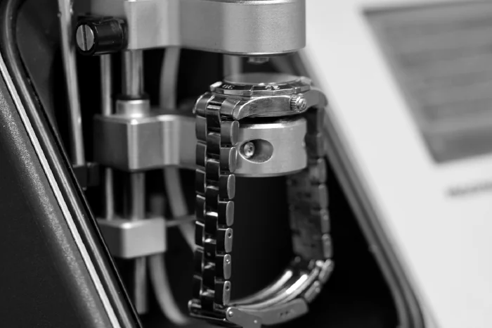 Replacement Batteries & Reseal (image: watch battery being repaired)