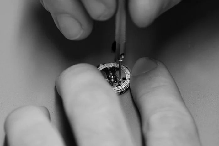Replacement Batteries & Reseal (image: watch battery being repaired)