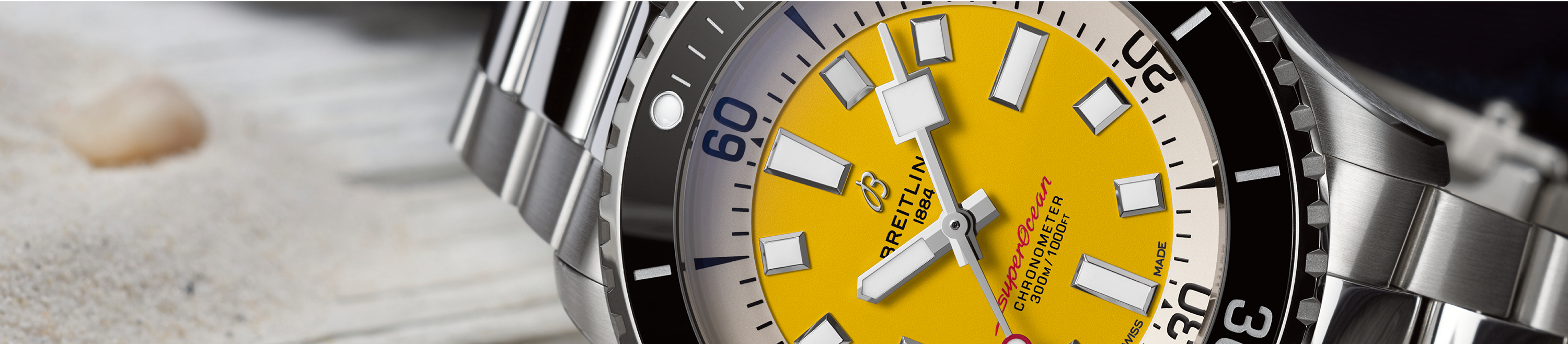 close up of dial on breitling superocean automatic 46 code yellow watch 