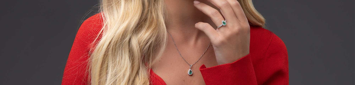 emerald jewellery​ - matching necklace and ring set on model