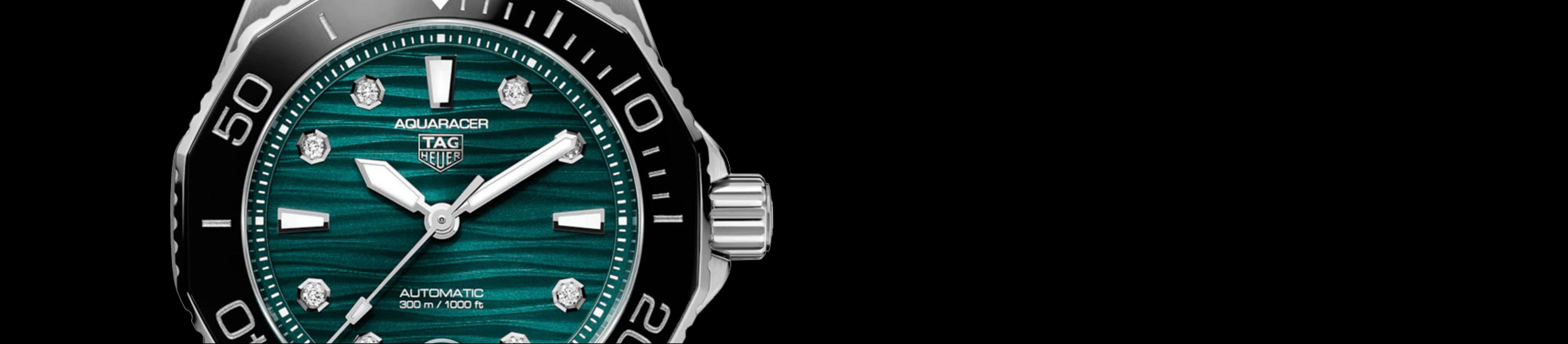 close up of dial on tag heuer aquaracer watch with blue dial 