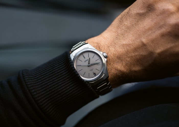 Image: Model wearing an Oris silver watch