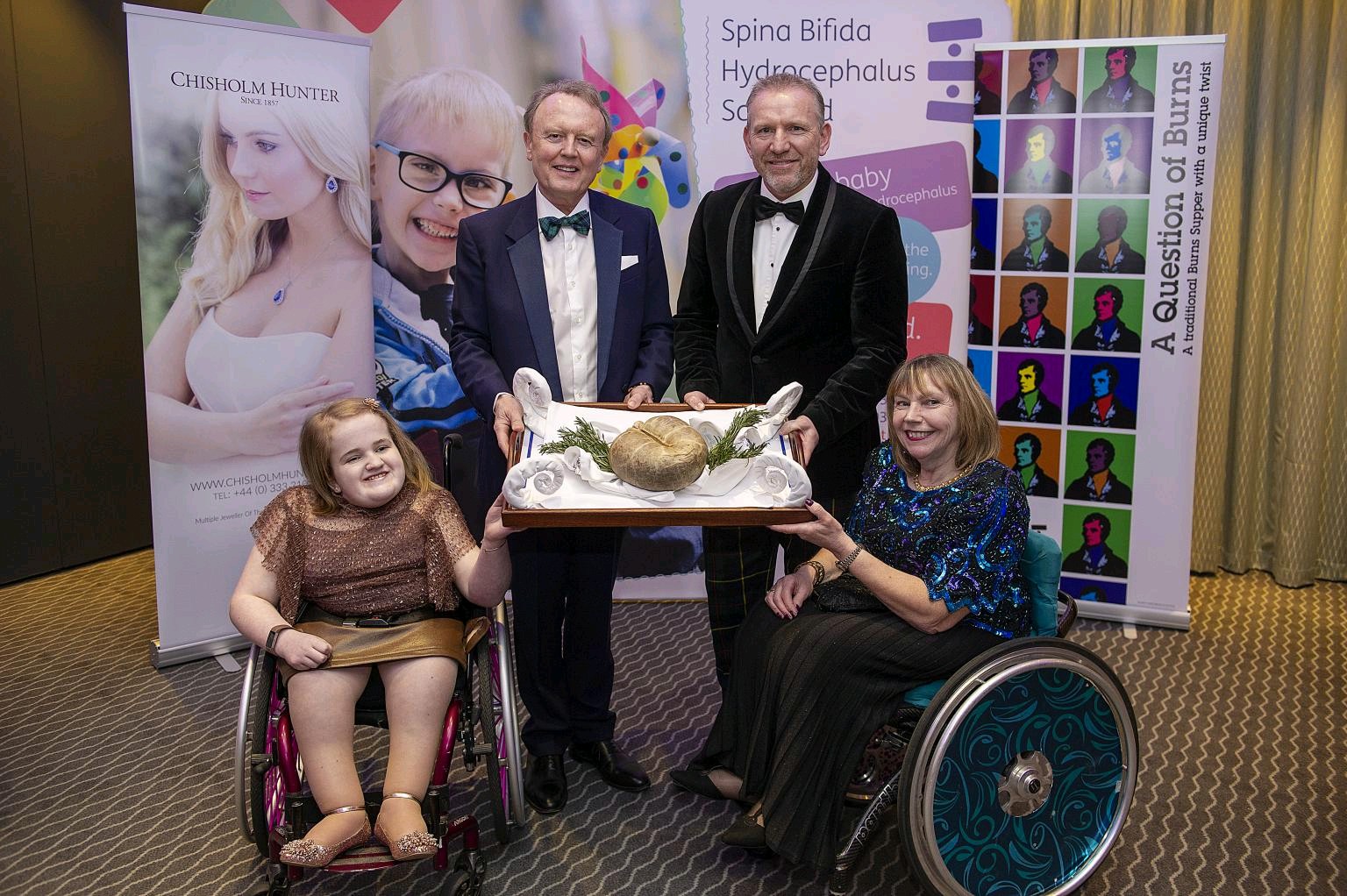 Image of Harry Brown with members of Spina Bifida Hydrocephalus Scotland (SBH Scotland) at their annual Burns' event