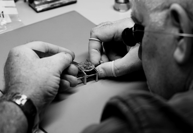 Warranted - Image of a watchmaker repairing a watch