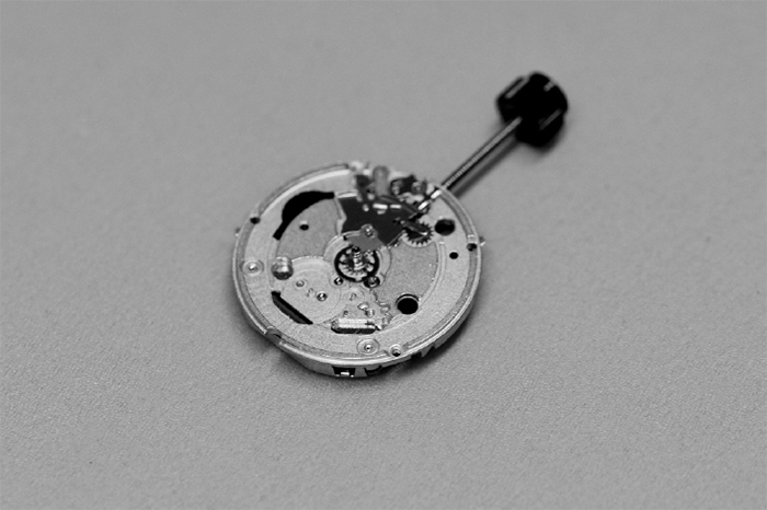 Crown & Stem Replacement (image: watch crown & stem placed on a workshop table)