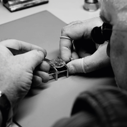 Image of one of our watchmakers repairing a watch.