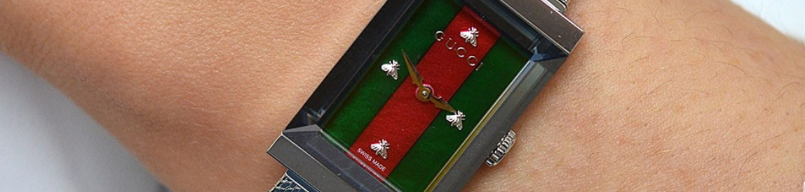 model shot of gucci g-frame watch with red and green striped dial