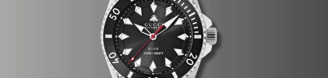 close up of gucci dive dial 