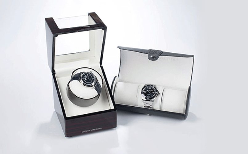 Free Gift with Purchase (Image: two watches in Chisholm Hunter boxes and watch rolls)